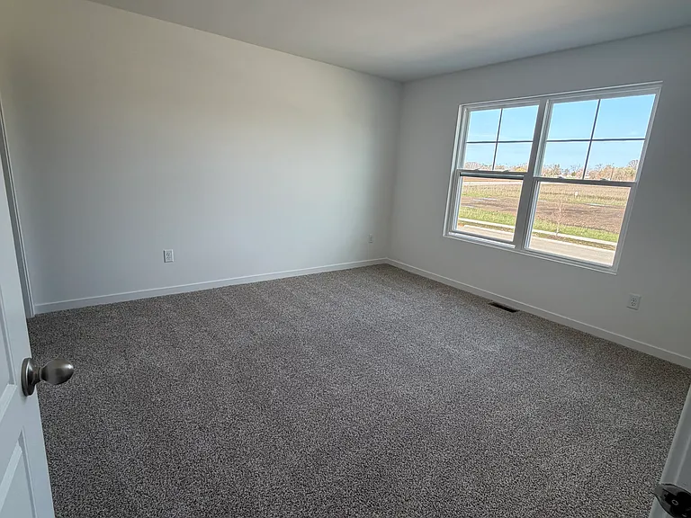 Primary Bedroom with Walk-In Closet and Private Bathroom