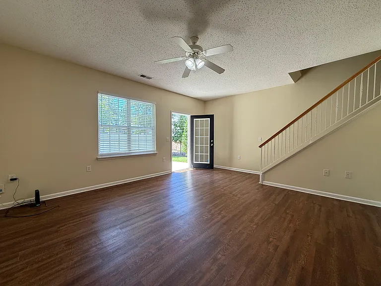 Another view of living room and back door.