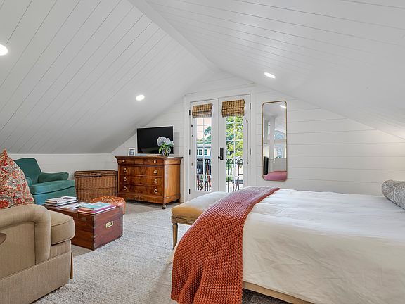 Lofted bedroom with Juliet balcony.