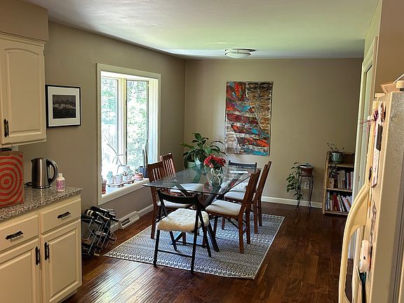 Dining space off of the kitchen, bay window overlooking the backyard