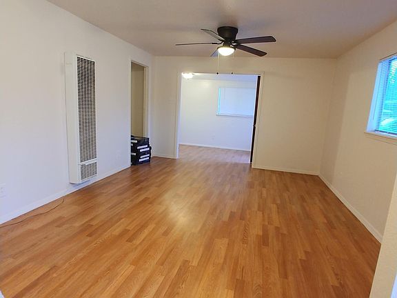 Living room, and small bonus room beyond.