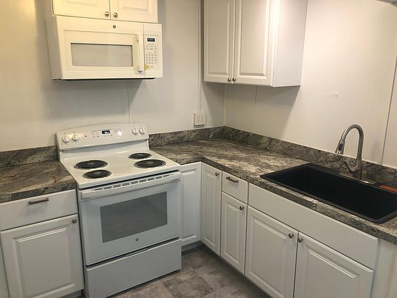 Kitchen with range microwave, plenty of storage in photo and more, not shown.