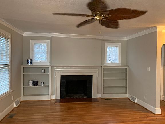 large living area with built in cabinets