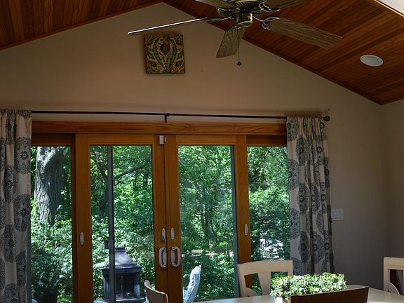 Beautiful sunlight through large Andersen sliding doors and skylights.