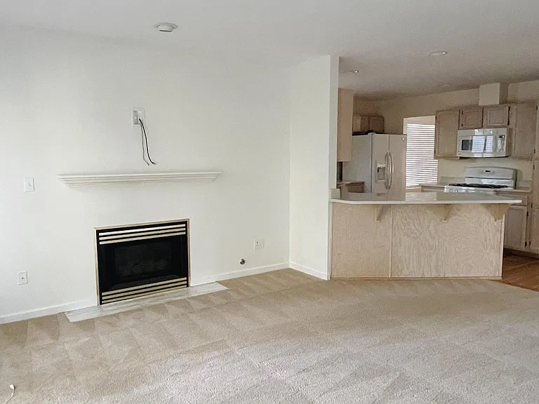 Family room w/ gas fireplace and wired for TV