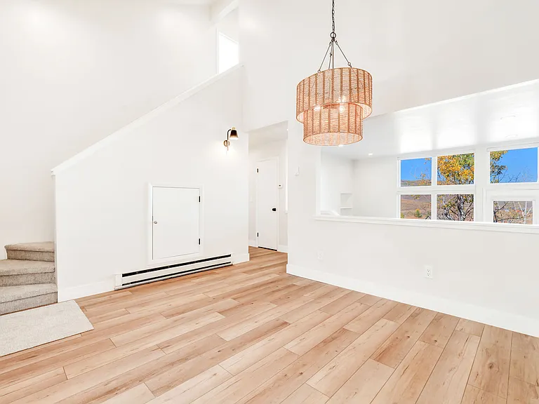 Stairs to upper level off dining area