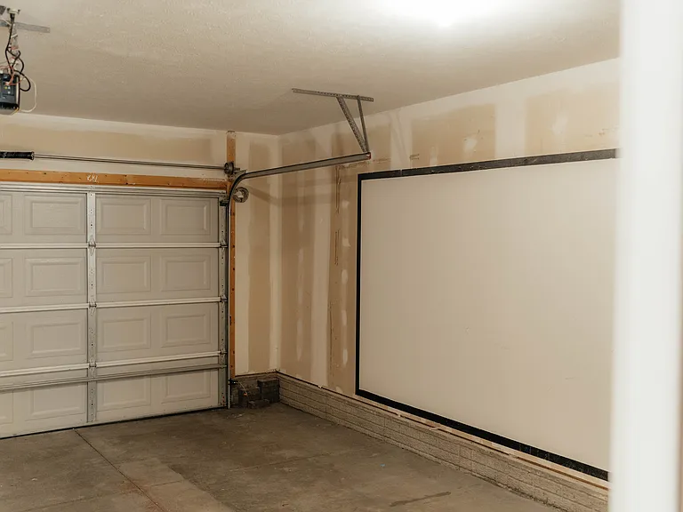 Garage is drywalled.