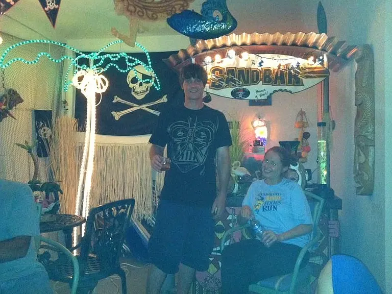 Single car garage is set up as a Tiki Bar.