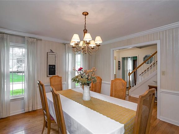 Dining room. Nice light and pretty hardwood floors.