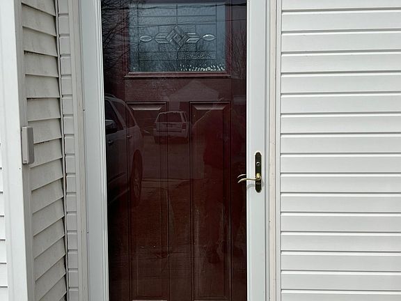 Side entry door with storm