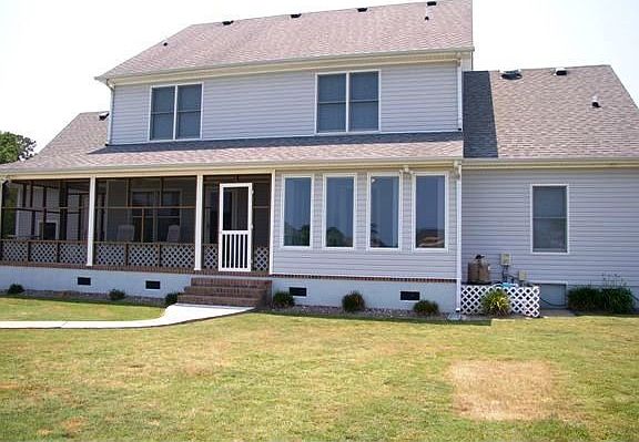 Back View w/Sunroom, screen in porch and patio