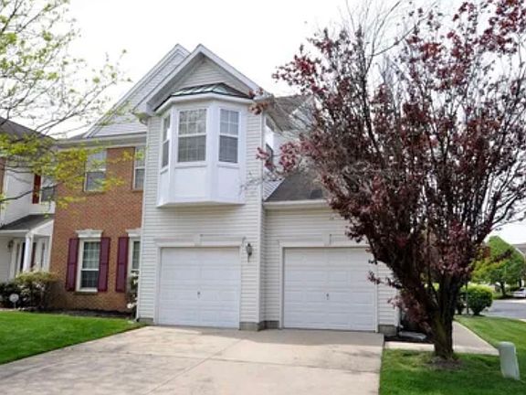 The house has two enclosed garages and, additionally, it offers space in front to park two more cars outdoors.