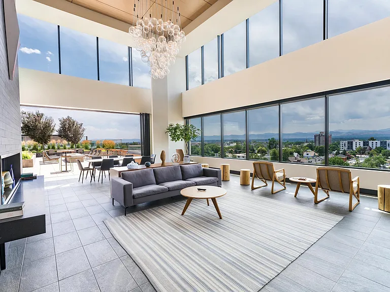 Soaring ceilings and sweeping views set the stage for this airy indoor-outdoor lounge_perfect for casual hangs or hosting with ease.