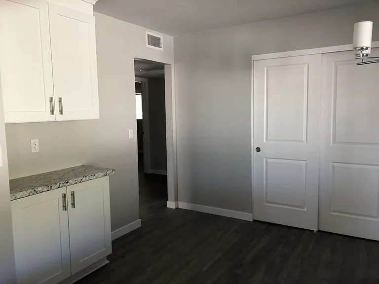 Dining area with more cupboard space and large pantry