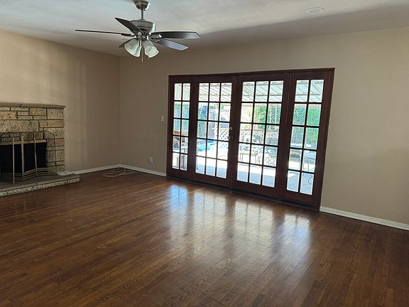 Living room with French Doors. View of backyard with spacious pool.