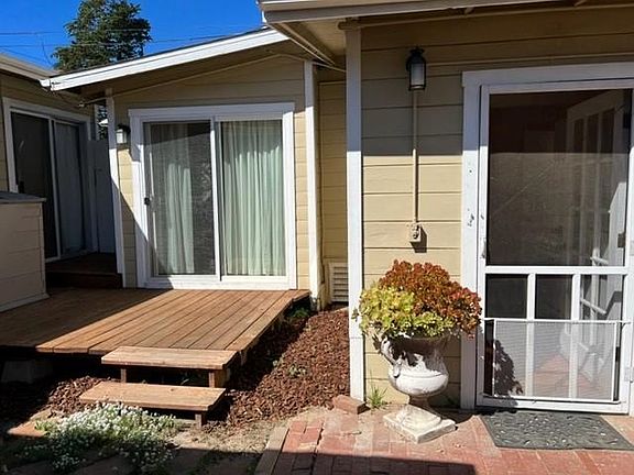 Right door goes into the kitchen, left deck and sliding door go into the bedroom.