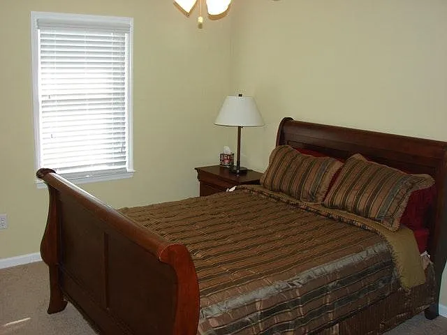 Front bedroom with a queen sleigh bed.