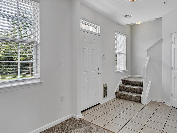 Front door opens to a foyer area. There is a glimpse of the den where you can set up a home office.
