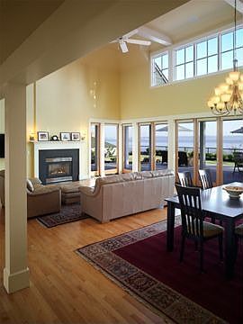View of living area in great room - multiple french doors to patio and views! 