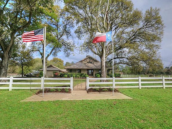 Added benefits include the 3 car garage and full quarters that are attached by a covered breeze way to the home.