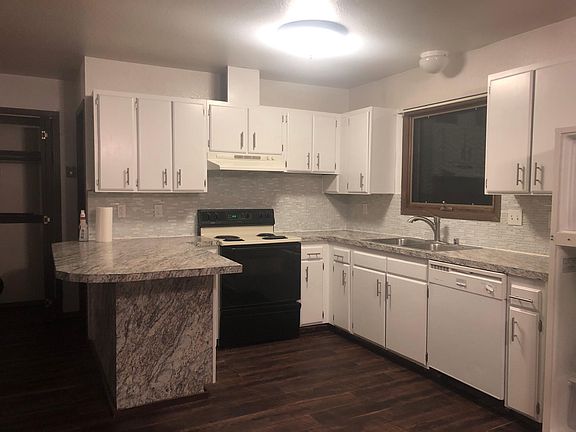 Updated photo of kitchen with dishwasher installed.