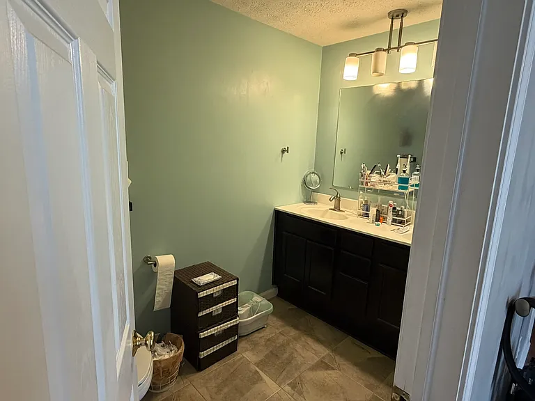 master bedroom with double sinks