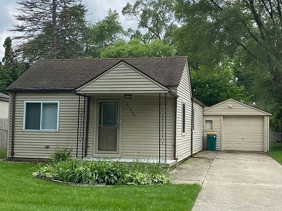 Driveway and 1 car garage with security lights