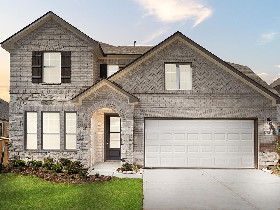 Welcome home to 2971 Golden Dust Drive located in the Sunterra community and zoned to Katy ISD.