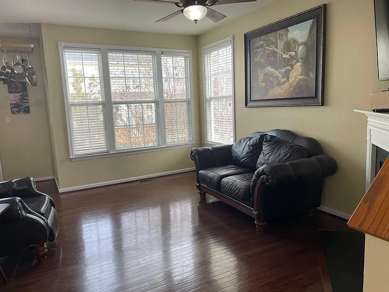 Family Living room with Fireplace area with great Natural lighting.