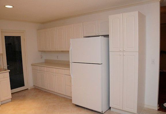 Kitchen and pantry area with roll-out shelving