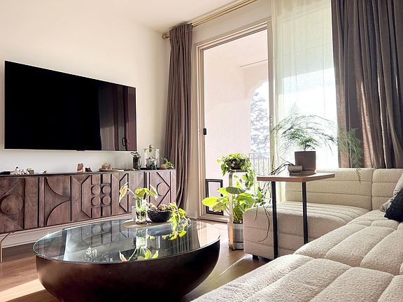 Living room with southeast-facing patio, double-pane sliding doors, pet screen door access and the best view in the Community!