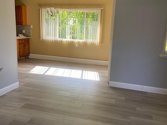 View from front door entering unit with living room and dining area