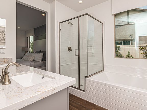 Owner s bath shown with a separate shower and tub.