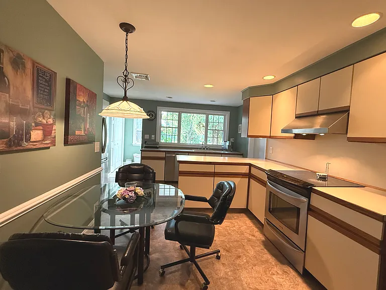 Shared kitchen with generous counter space and additional dining area