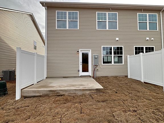 Half-fenced backyard with paito