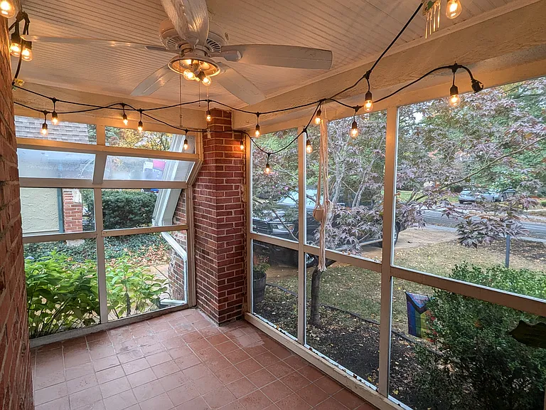 screened-in porch at the front of the house.