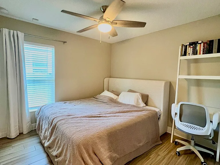 Bedroom two with king sized bed and desk setup