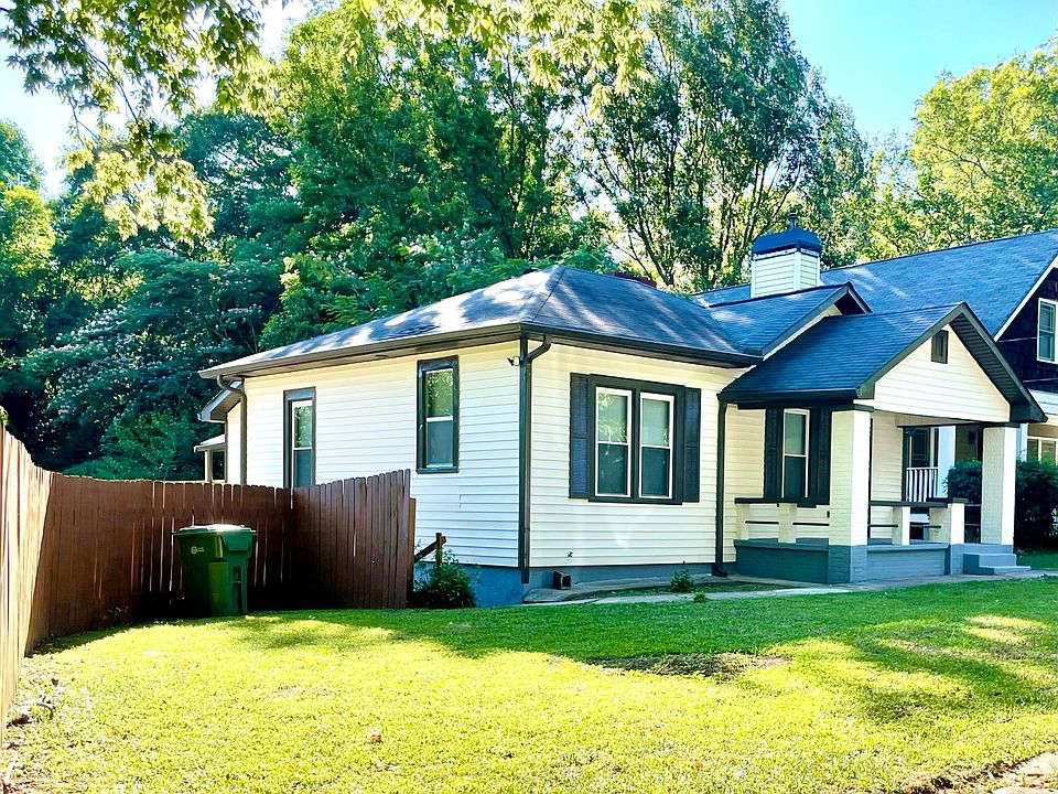 nice porch and fenced front yard