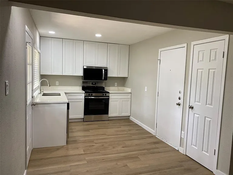 Kitchen showing door to garage and Pantry
