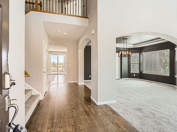 Front entry to home looking into formal living room and formal dining room.