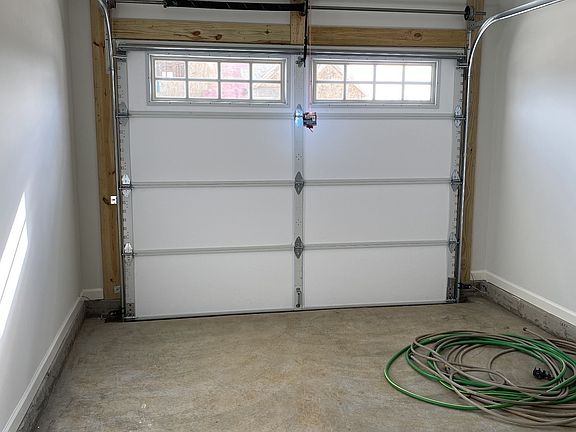 1 Car insulated and finished garage with insulated garage door with windows File Photo