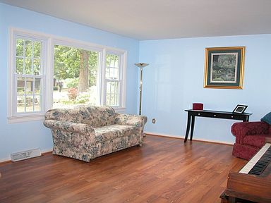 Lovely Living Room with laminate wood floor and large picture window.