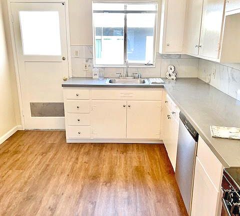 Kitchen has back door to side of property