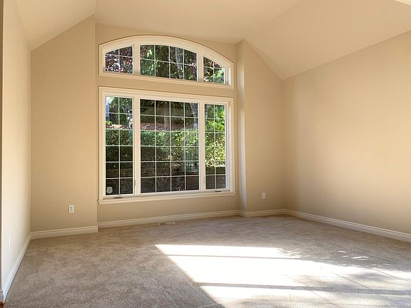 Family room with high ceiling and super large window