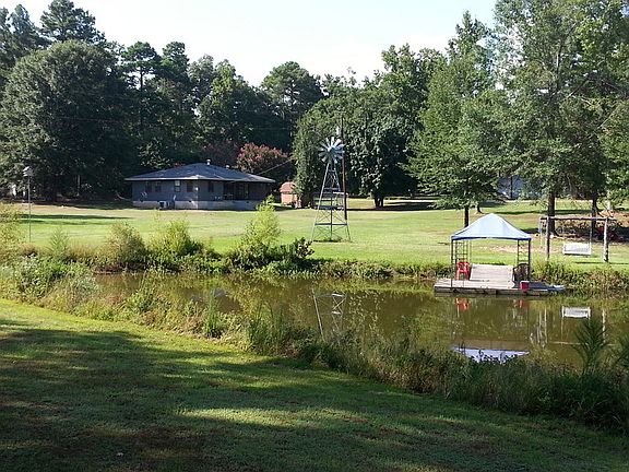 Partial View of Pond
						:
						Pond comes with floating/covered dock, aerator windmill and stocked with fish.