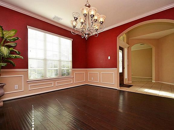 Dining room offers bamboo hardwoods and a chair rail