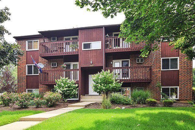 Front of the building professionally landscaped - Large front balcony can carry large grill, small table and chairs