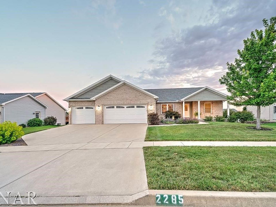 Gorgeous walk-out ranch with three car garage.