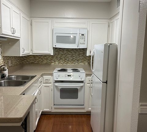 Kitchen. Electric stove, oven, refrigerator and dishwasher. Pantry closet.