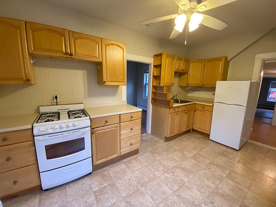 Kitchen and doorways to office off the kitchen (between the cabinets) and entry to living room beside refrigerator